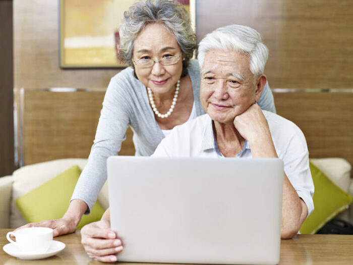 Older couple looking at computer