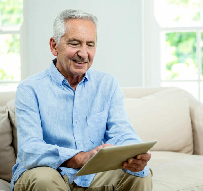 Senior man looking at tablet